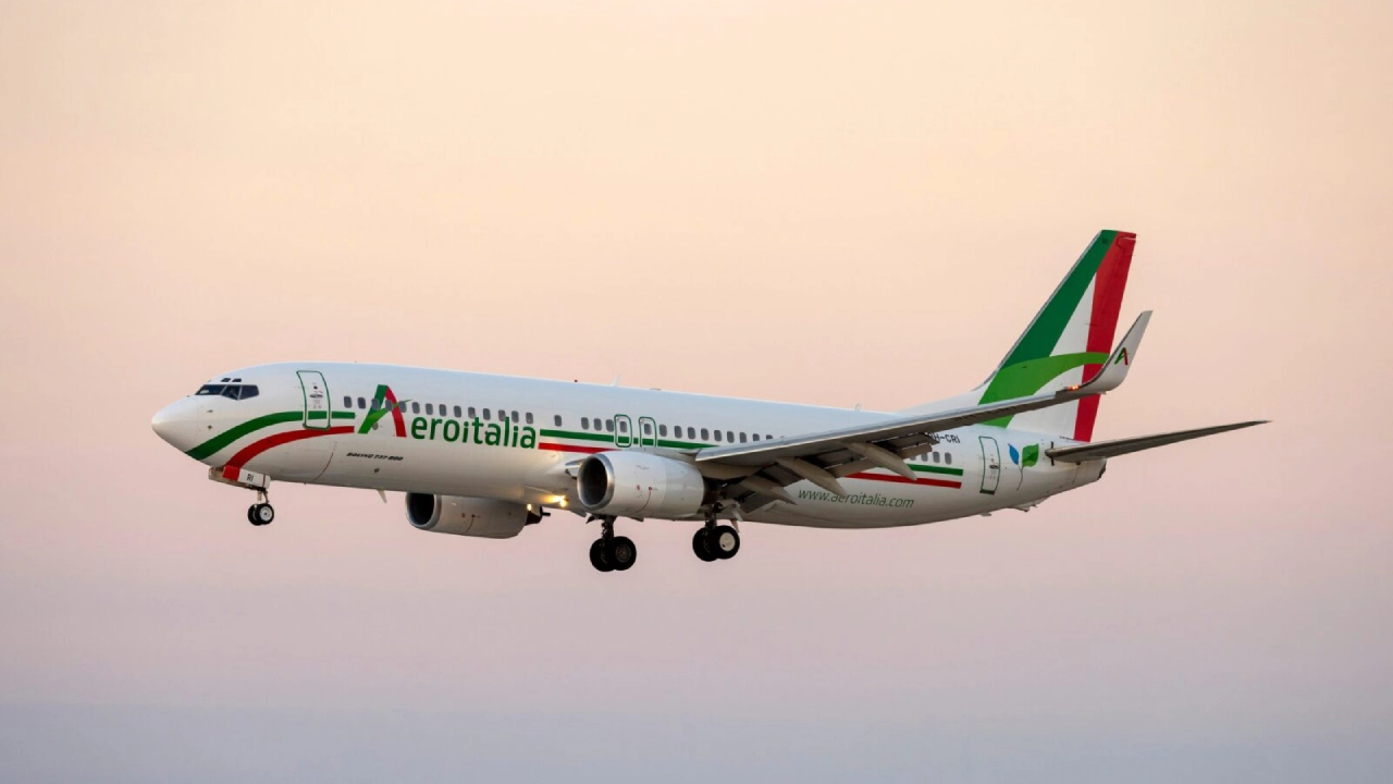 Which terminal does Alitalia use at JFK Airport?